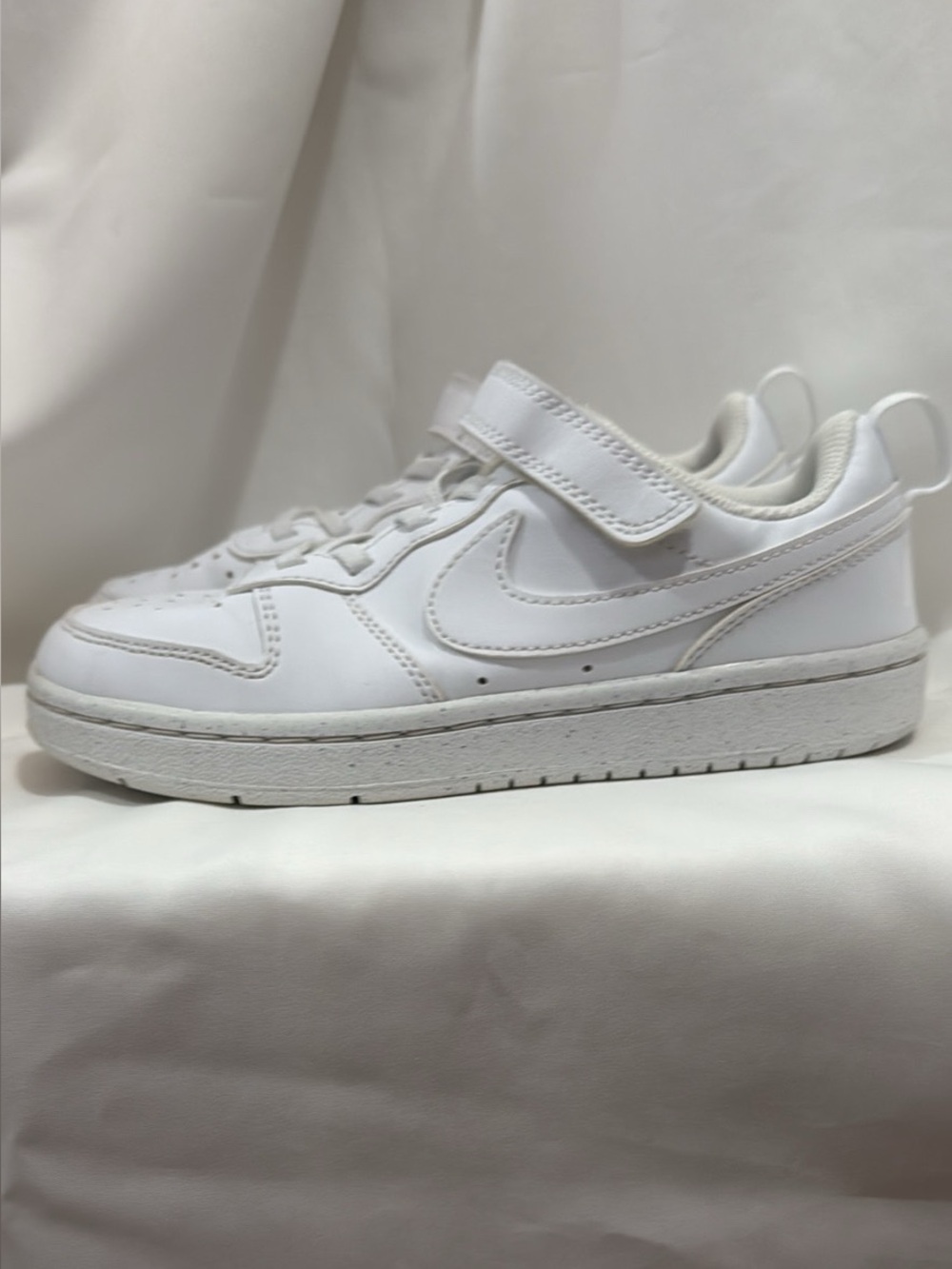 Boys white Nike sneakers